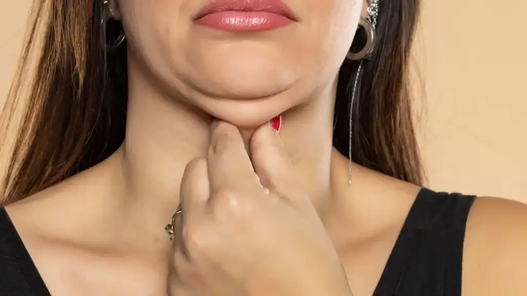 An image of a woman with double chin, sad, worried : Non Surgical Double Chin Removal Treatment in Gilmerton, UK